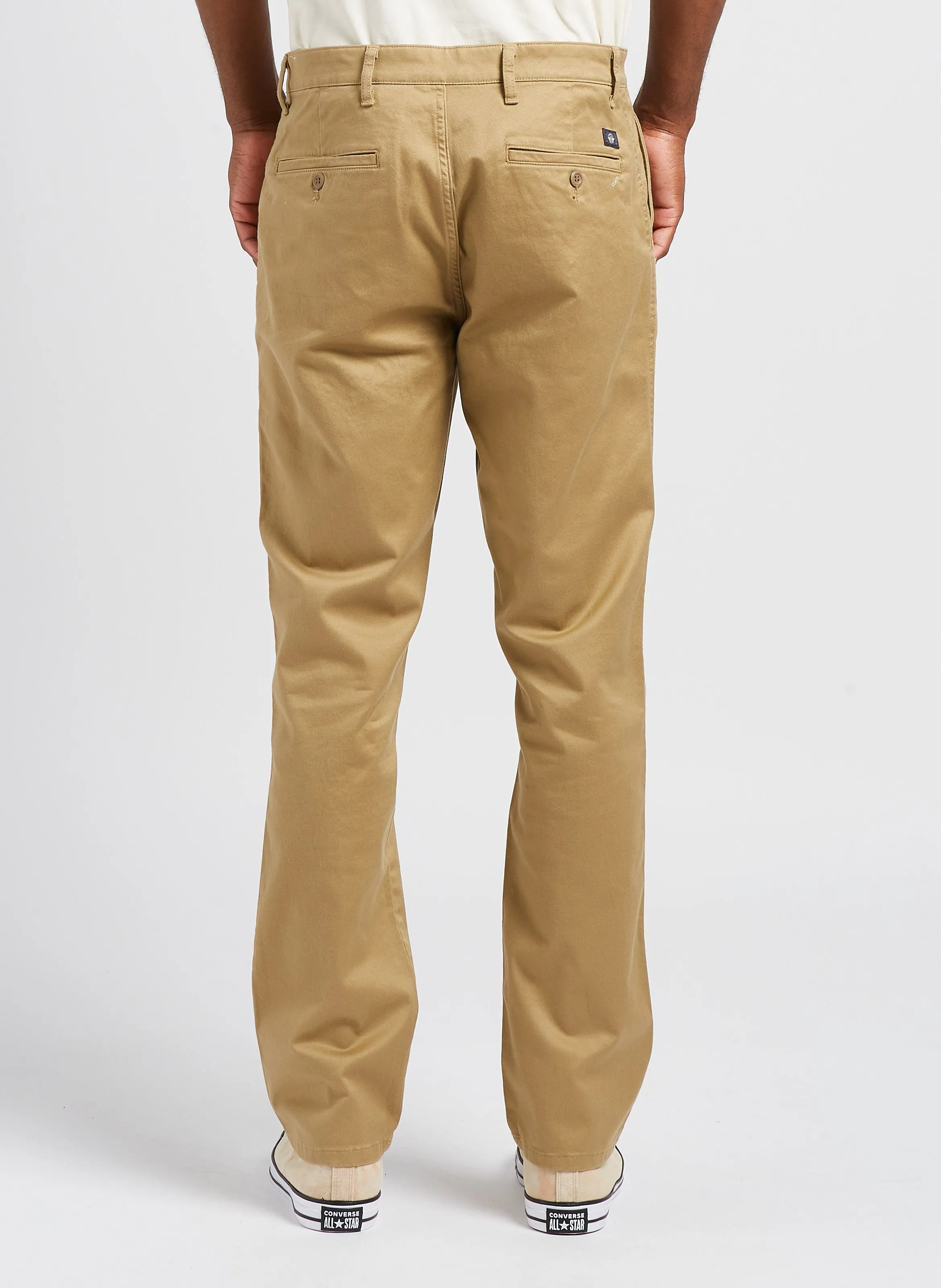 Pantalón chino slim fit de algodón elástico en dorado